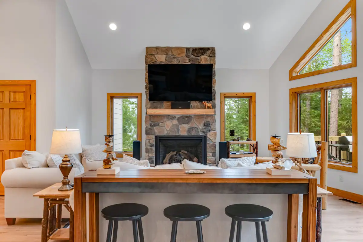 Interior view of the luxury fireplace and modern bar top with bar stools