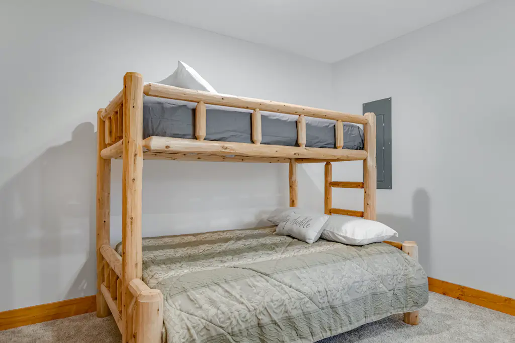 Bedroom photo of bunk beds with wooden frame